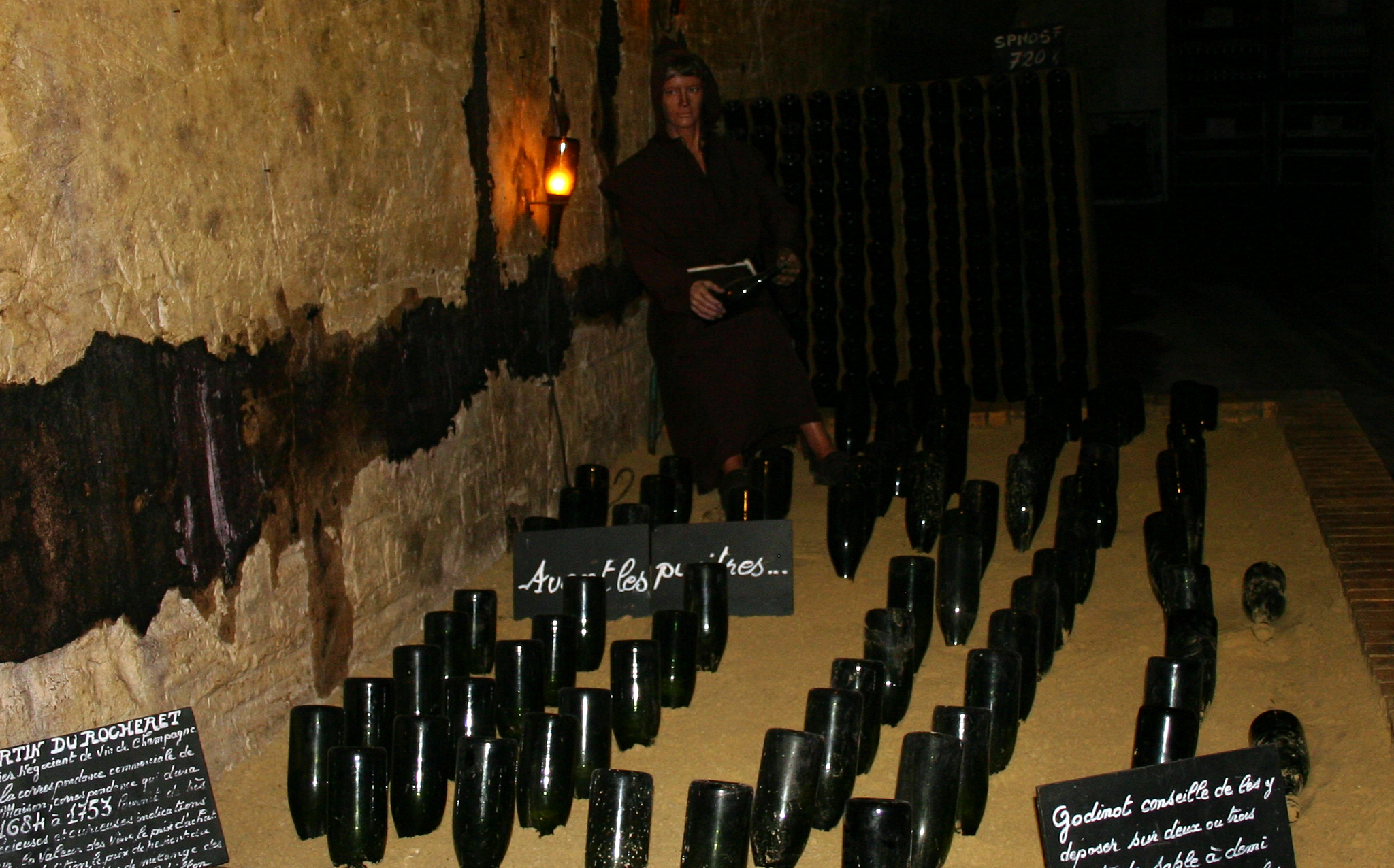 A Monk Mannequin - illustrating the first method for riddling (turning the bottles) 